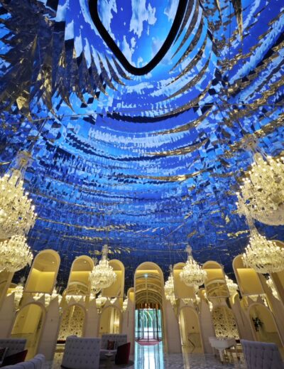 Raffles Doha main lobby with blue chandelier ceiling